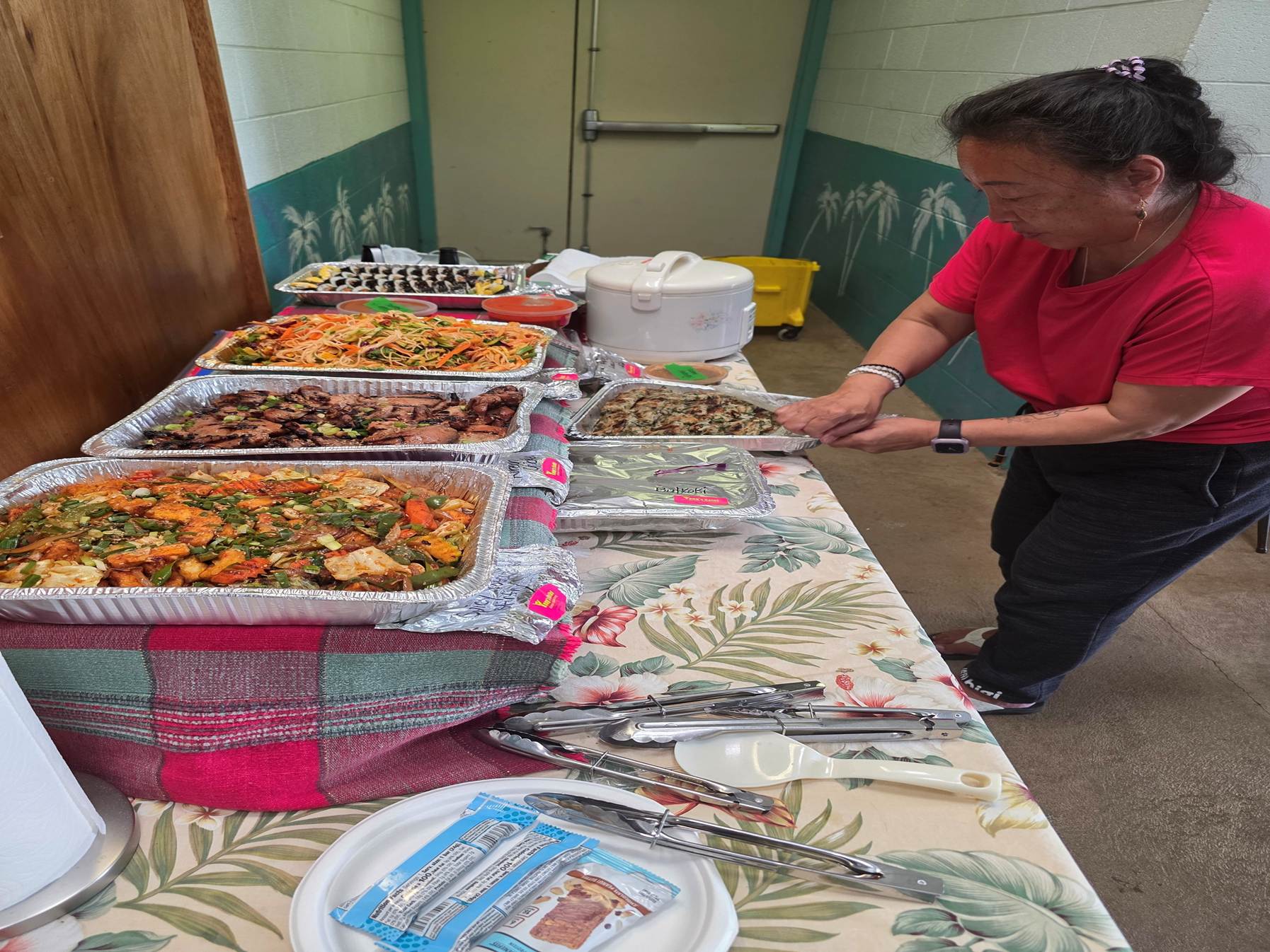 A person standing next to a table full of food

AI-generated content may be incorrect.