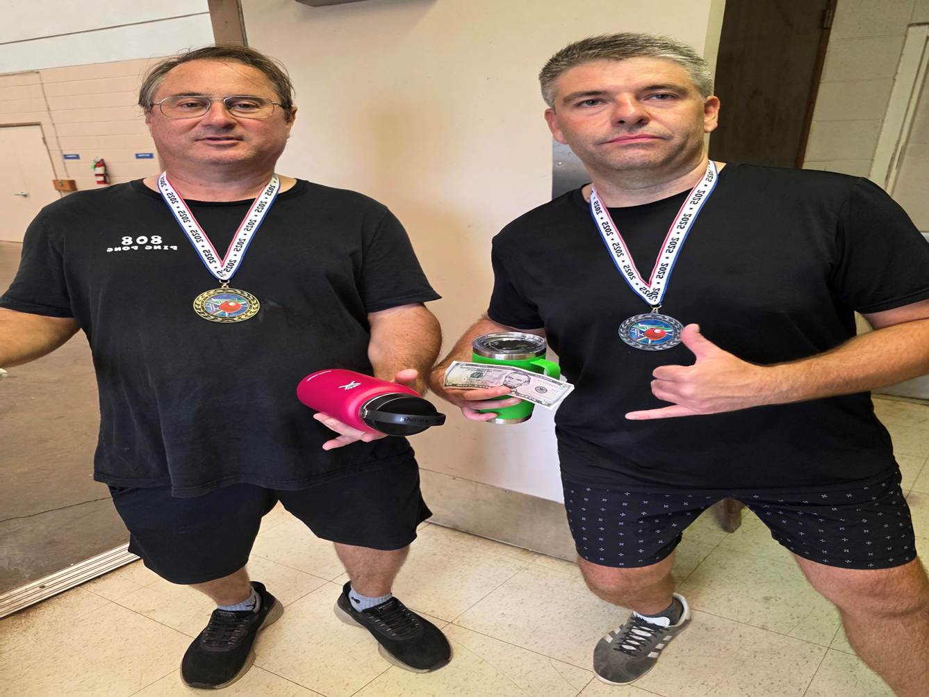 A couple of men holding drinks

AI-generated content may be incorrect.