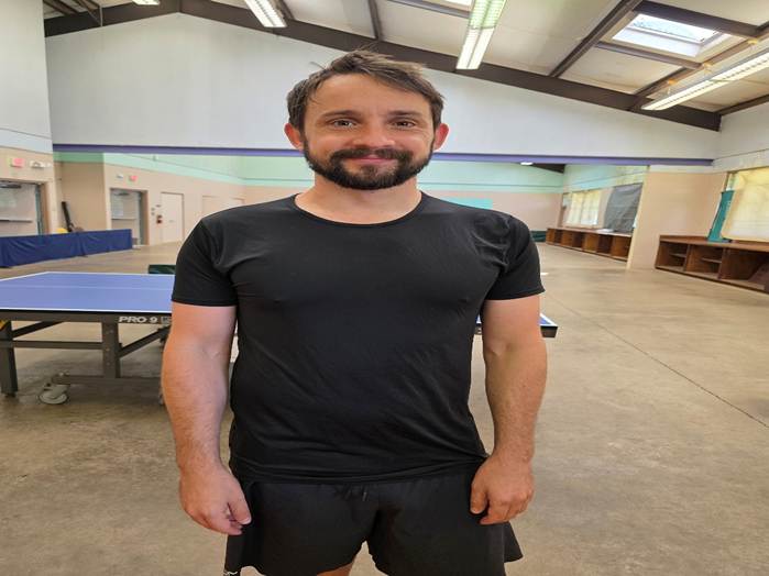 A person standing in a room

AI-generated content may be incorrect.