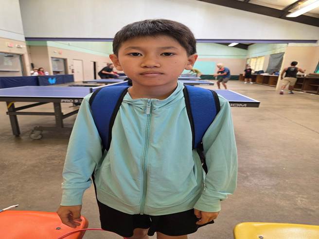 A child standing in a room

AI-generated content may be incorrect.