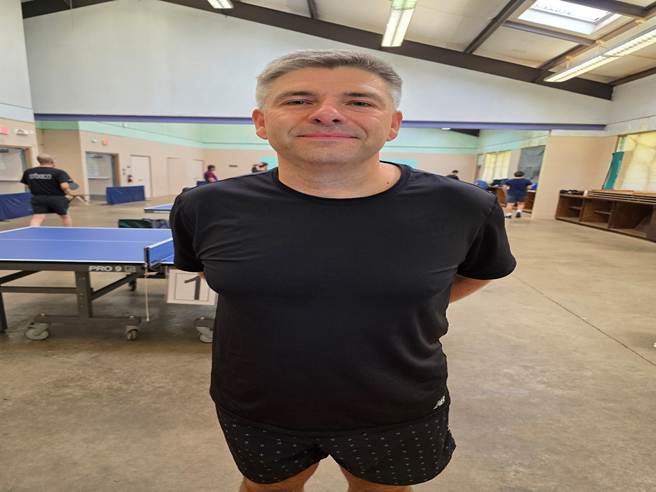 A person standing in a room

AI-generated content may be incorrect.